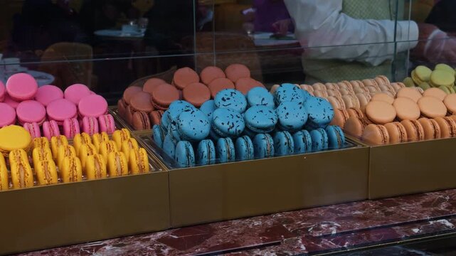 A Stunning and EyeCatching Colorful Display of Macarons at the Bakery Counter for Everyone to Enjoy and Truly Savor