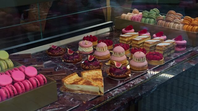 A Colorful Assortment of Pastries and Delightful Macarons Beautifully Arranged in a Patisserie Display