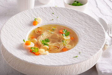 Professional broth soup as a fine dish in a restaurant.
