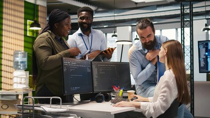 Startup newcomer making friends in office, learning how to use machine learning tech. Upbeat young...