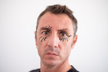 Obraz premium Portrait of a man with a face made up for Halloween. The man is forty years old and of Caucasian origin