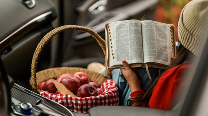 Reading the Bible with Apples in a Car