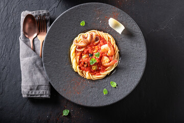 Professional spaghetti bolognese with high-end presentation on plate.