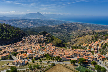 Fototapeta premium Aerial drone view of Gratteri historic medieval Sicilian mountain village with stone buildings in summer surrounded by Madonie Natural Park forest near Cefalu bay Sicily island southern Italy Europe