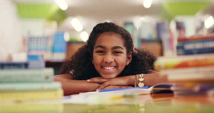 Girl, child and face at library with education, smile or excited with pride with project at school. Kid, portrait and pupil with confidence for development, scholarship and learning in Costa Rica
