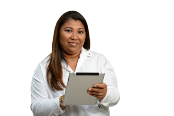 Woman using tablet smiles looking at camera