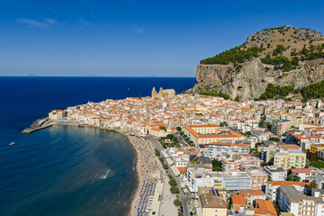 Fototapeta premium Aerial drone view of Cefalu historic medieval old town with cathedral beach and turquoise Tyrrhenian Sea in summer on northern coast of Sicily island southern Italy Europe Mediterranean destination