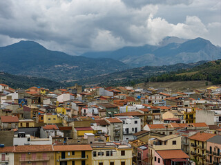 Aerial drone view of Campofelice di Roccella, a historic Sicilian village in Palermo,Sicily, Italy, featuring traditional stone houses, the Madonie Mountains, and the iconic highway viaduct