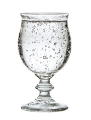 Elegant glass of water with bubbles against a dark background.