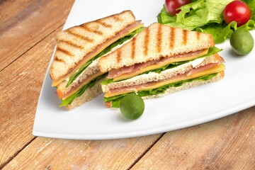 Tasty fresh sandwiches with vegetables on the desk