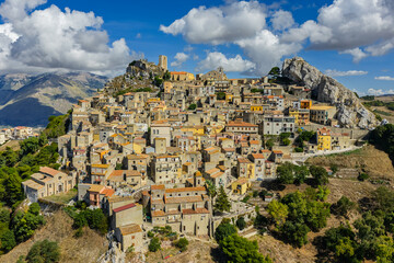 Aerial drone view of Sclafani Bagni, a small historic Sicilian mountain town perched on cliffs with panoramic views of Caltavuturo and rugged Madonie Mountains, Sicily, Italy.Small Village in Sicily