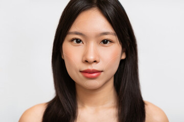 Fototapeta premium A collection of close-up portraits highlights a woman's facial features, showcasing her smooth skin, natural makeup, and healthy hair. The collage captures beauty and simplicity.