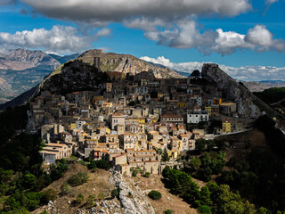 Aerial drone view of Sclafani Bagni, a small historic Sicilian mountain town perched on cliffs with panoramic views of Caltavuturo and rugged Madonie Mountains, Sicily, Italy.Small Village in Sicily