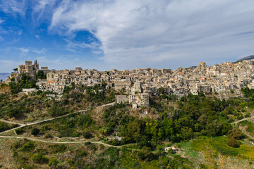 Fototapeta premium Aerial drone view of Petralia Soprana, a historic Sicilian mountain town with panoramic views of the Madonie Mountains,Petralia Soprana famous Church of Saint Mary of Loreto, Sicily, Italy
