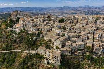 Fototapeta premium Aerial drone view of Petralia Soprana, a historic Sicilian mountain town with panoramic views of the Madonie Mountains,Petralia Soprana famous Church of Saint Mary of Loreto, Sicily, Italy