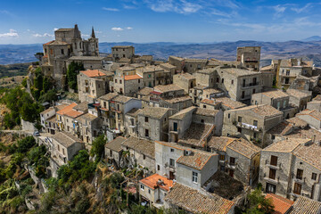 Obraz premium Aerial drone view of Petralia Soprana, a historic Sicilian mountain town with panoramic views of the Madonie Mountains,Petralia Soprana famous Church of Saint Mary of Loreto, Sicily, Italy