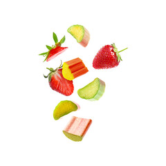 Fresh rhubarb pieces and strawberries flying in air against white background