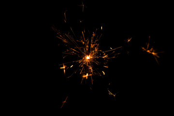 Christmas advertising. Christmas sparkles background. Fire sparkle background. Golden fire sparkle isolated on a black background. New year spark on black background. Light effect sparkle.