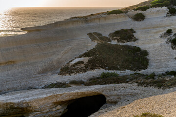 Su Riu de Sa Ide cliffs overlooking the mediterranean sea at sunset in Sardinia, Italy