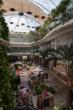 View from the top floor of the Quinta Alegria mall inner court with stores and small businesses stalls at Fifth Avenue in a tourist city center.