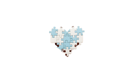 Blue and white jigsaw puzzle pieces forming a heart.