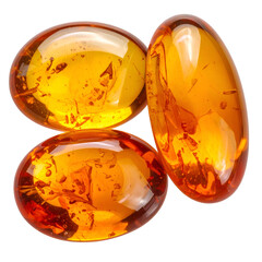 Close-up of three polished, translucent amber gemstones against a solid black background