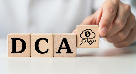 DCA wooden block concept. A wooden block displays the letters "DCA," set against a textured wooden background, emphasizing simplicity and minimalism.