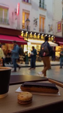 Experience a charming street scene filled with delicious pastries and aromatic coffee in the lovely city of Paris