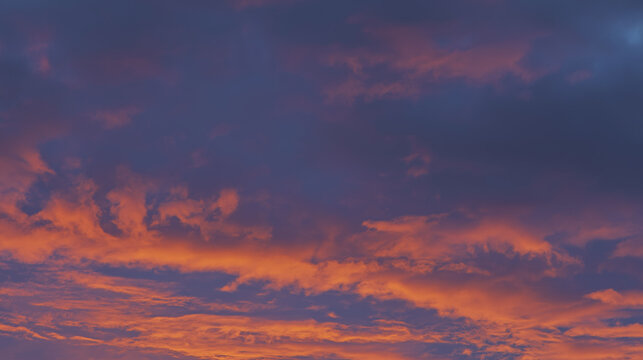 Golden sunset glow illuminating a beach restaurant with soft reflections of string lights.