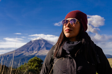 Woman hiking volcano trail with popocatepetl in mexico