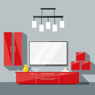 Modern living room interior with a large flatscreen television mounted above a red entertainment center and red cabinets on a gray wall
