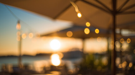 Beach restaurant at golden hour with string lights, evoking a warm and inviting atmosphere.