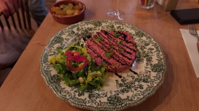 Exquisite Presentation of a Gourmet Dish using Fresh, HighQuality Ingredients on an Elegant Decorative Plate