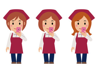 スマホを見る真紅のエプロンと三角巾の女性