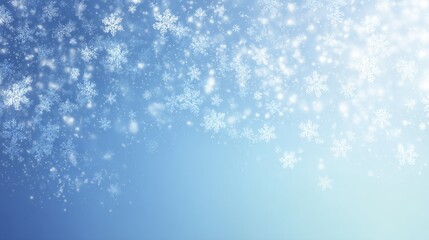 Numerous white snowflakes falling with shimmering light particles on a blue gradient winter background