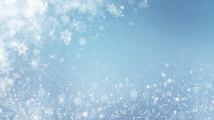 Delicate falling snow crystals and shimmering particles on a light blue background