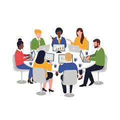 Diverse business team collaborating around a table with laptops and charts during a meeting