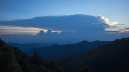 A majestic mountain silhouette against a twilight sky, radiating calm and natural beauty.