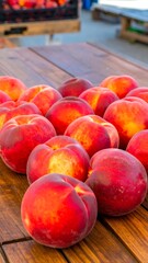 Fresh peaches arranged on a wooden table