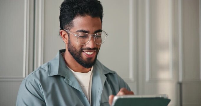 Creative, man and reading with tablet at house for research, proofreading article and copywriting. Person, remote work and digital for story submission, editor feedback and information on publication