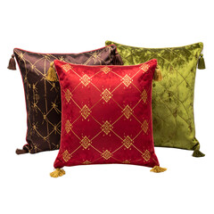 Three decorative velvet pillows brown, red, and green with golden embroidered patterns and tassels