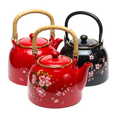 Three colorful, patterned kettles with bamboo handles, arranged against a black background