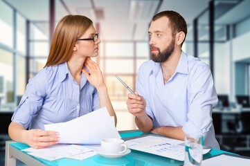 Smart young business people walking in office,