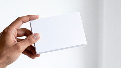 Hand holding white business card