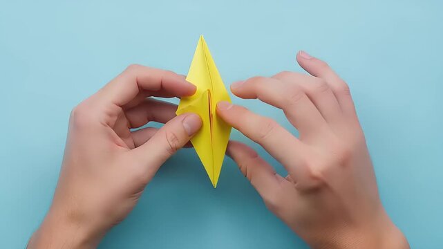 Origami Star Folding Process Close Up Hands.