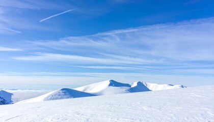 Beautiful Winter Landscape of Snow Covered Mountain Peaks Under Blue Sky