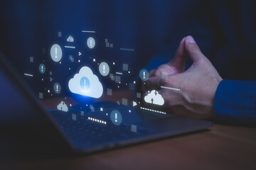 Cloud computing data protection concept with warning symbol showing over a laptop, representing cybersecurity threats, data loss prevention, and secure cloud storage in digital technology environment.