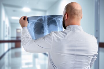 Fototapeta premium Senior doctor hold xray for thinking in clinic