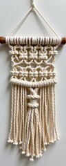 Handcrafted macrame wall hanging with intricate knot patterns and long tassels, bohemian home decor accessory for living rooms bedrooms or craft displays