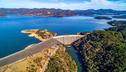 National reservoir or dam in the middle of the valley and the road connecting the city at chiang rai thailand high angle view from drone camera
2